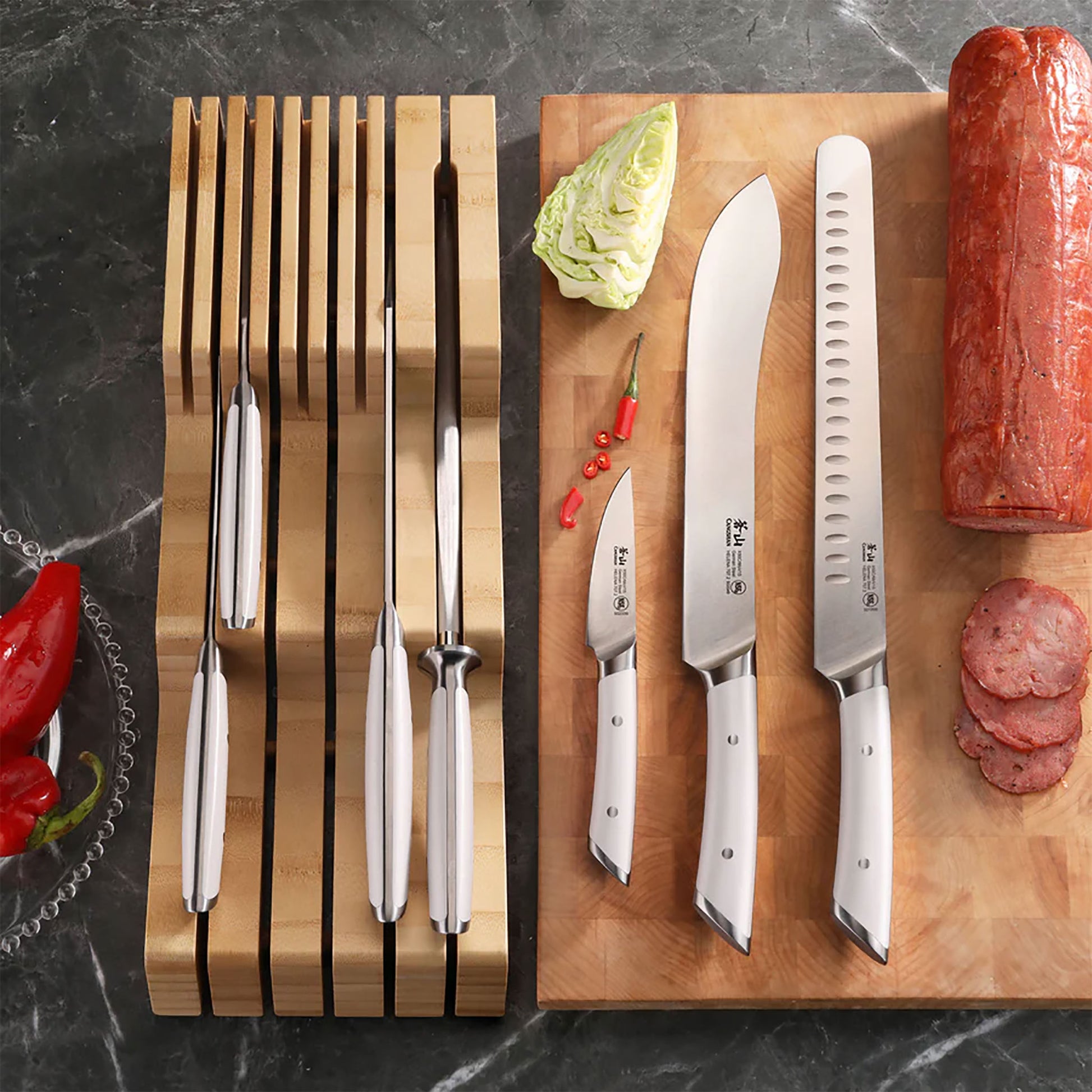 JK Adams Cangshan Helena 8 Piece BBQ Knife Set Lifestyle with knives on an end grain cherry board next to salami and hot peppers.